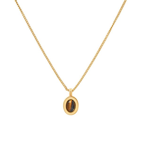 Tiger's eye pendant layered with sweater chain necklace